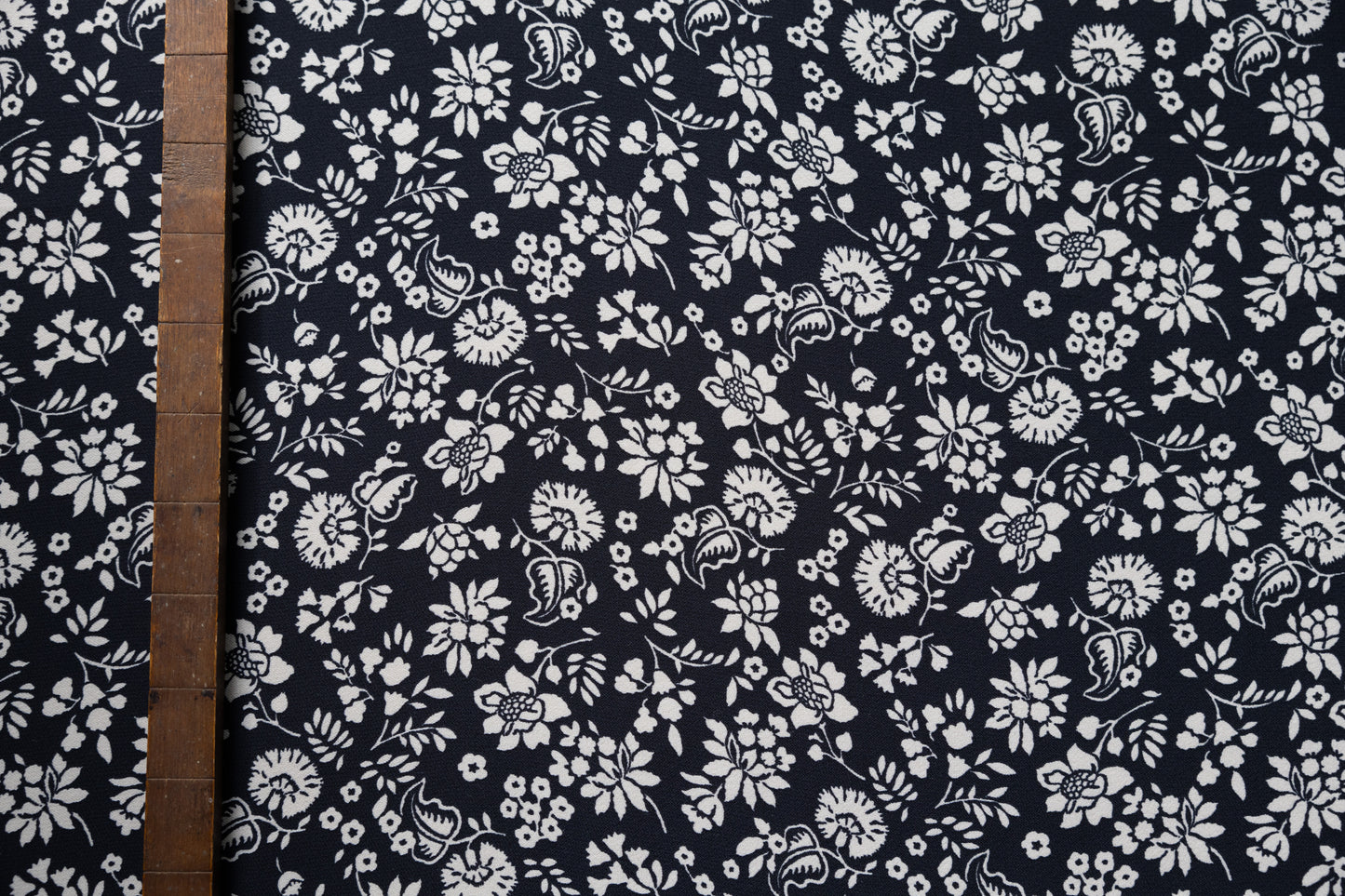 Black and ivory dead stock floral viscose, sold per meter