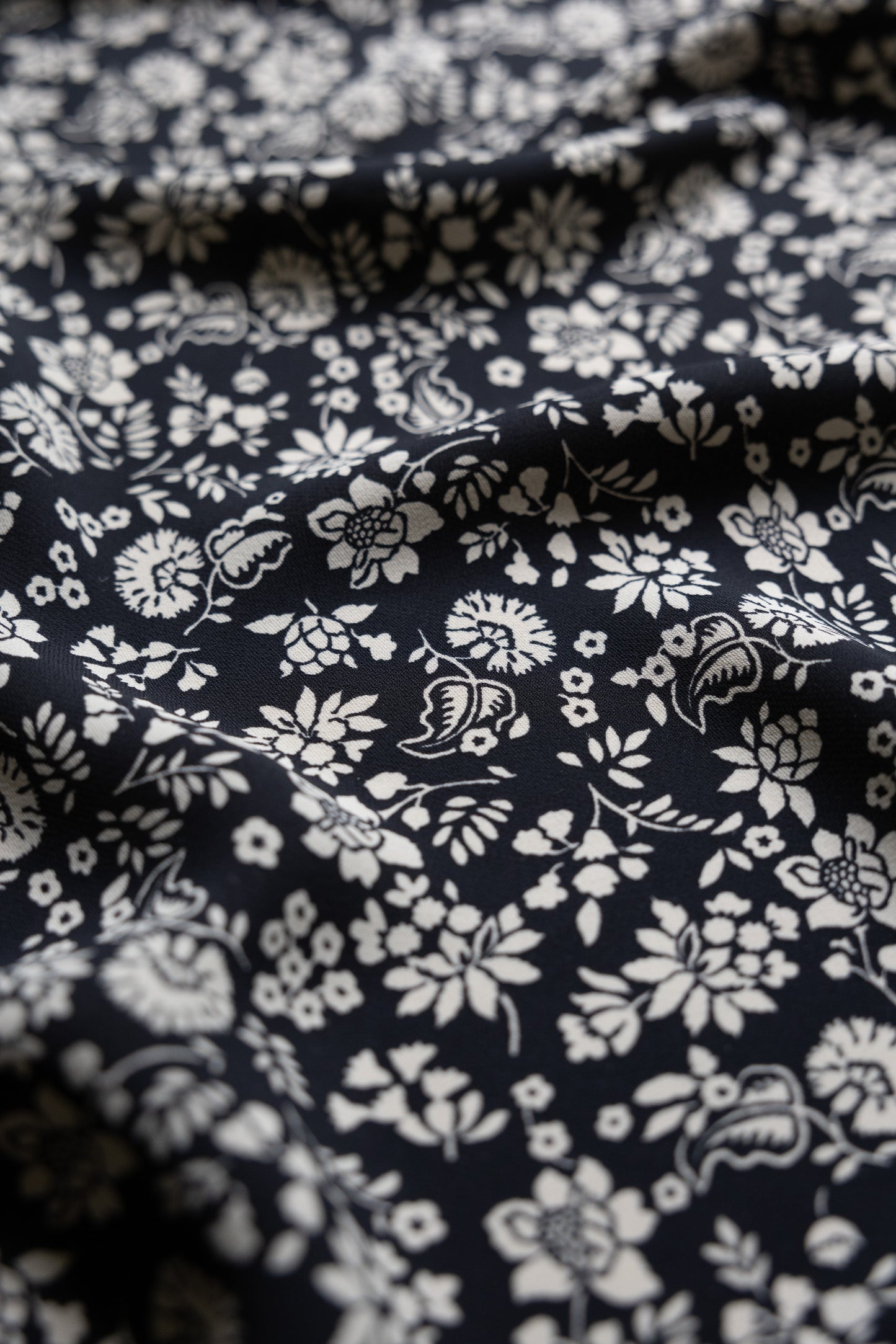 Black and ivory dead stock floral viscose, sold per meter